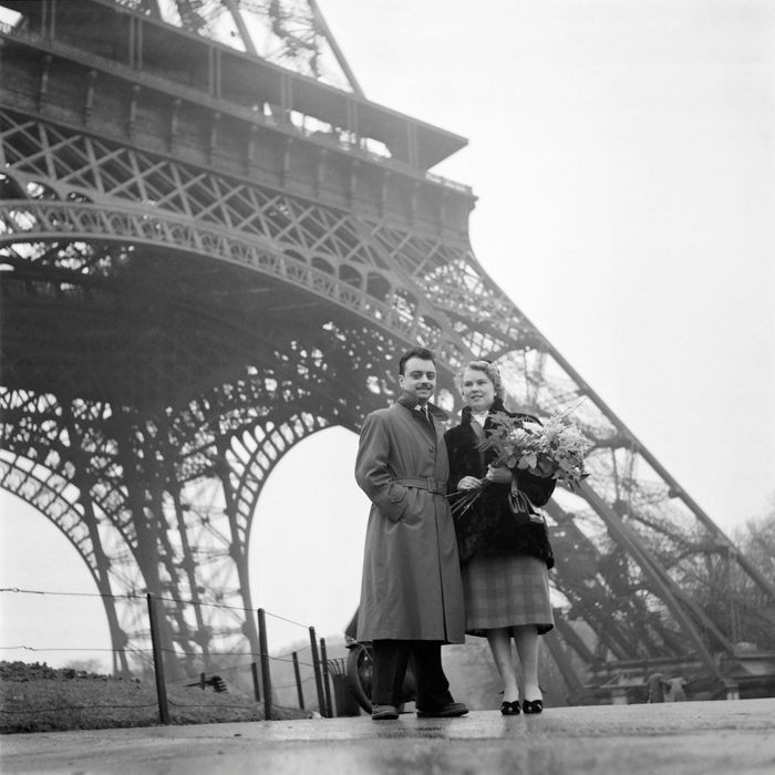 A couple of lovers pose in front of the Eiffel Tower in Paris during the Valentine's Day Lovers Contest on February 13, 1954. (Photo by - / INTERCONTINENTALE / AFP) (Photo by -/INTERCONTINENTALE/AFP via Getty Images)