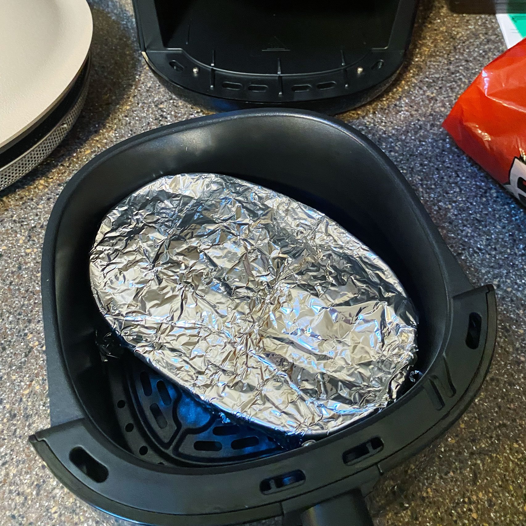 You Should Be Cleaning Your Kitchen With Aluminum Foil