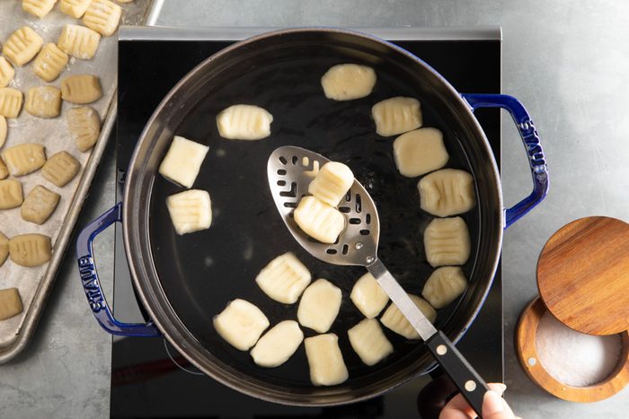 Gnocchi being boiled in small batches