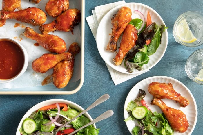 Air Fryer Chicken Legs served hot with sauce and salad