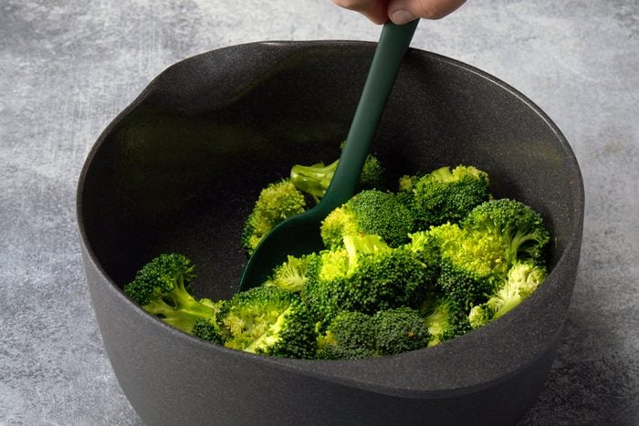 Tossing The Broccoli in Large Bowl