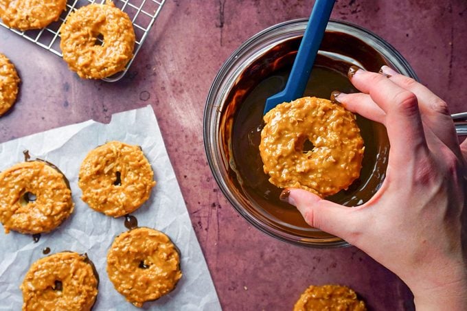 dipping cookies in the chocolate