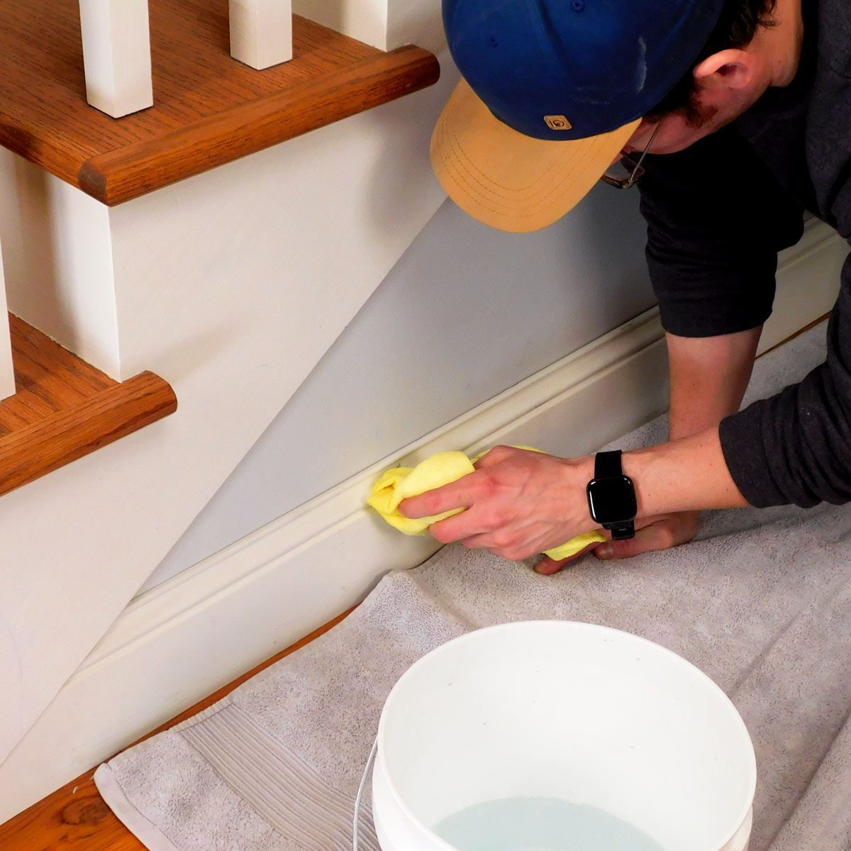 How To Clean Baseboards man cleaning the grout