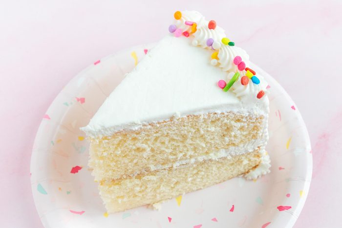 slice of cake from a safeway grocery store on pink background