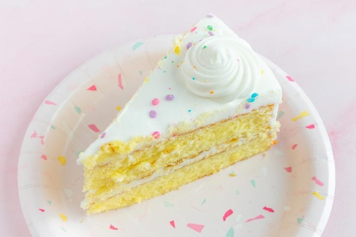 slice of cake from a winco grocery store cake on pink background