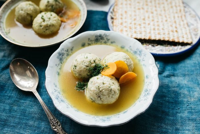 Bowl with matzo balls on a blue table cloth