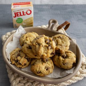 Pudding Chocolate Chip Cookies on a plate with a box of jello pudding in the background