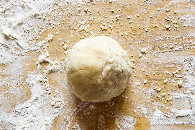 ball of dough for lemon bars on flowered surface