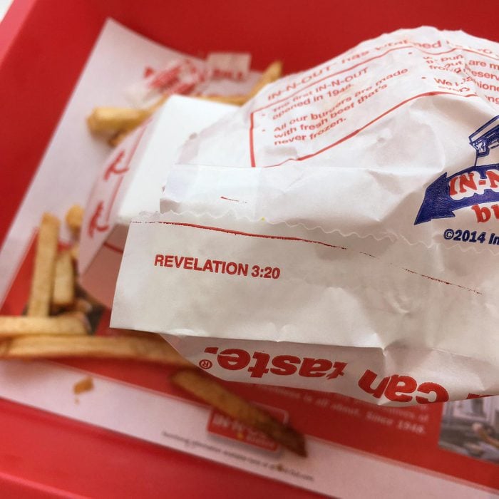 In N Out food packaging with a Bible Verse Revelations