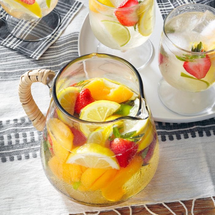 glass pitcher filled with fresh fruit and water
