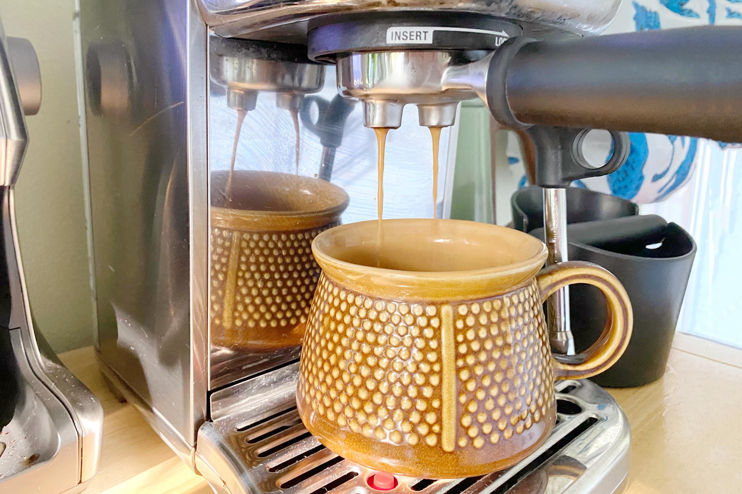 Breville Espresso machine with a mug