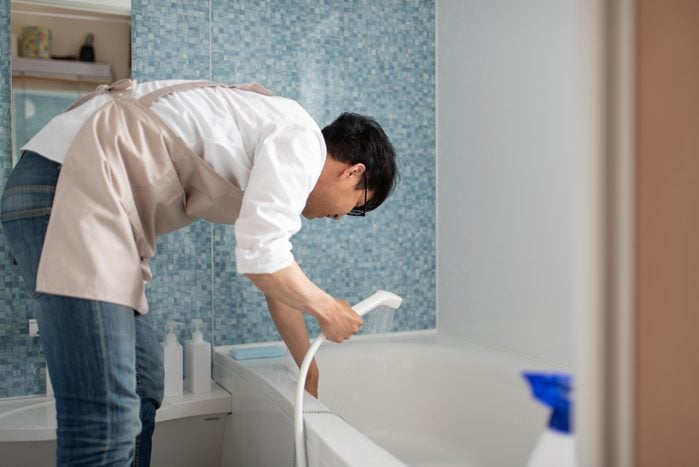 Stay-at-home-father cleaning in bath room