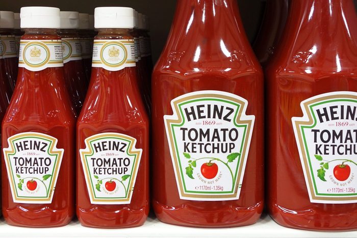 row of Heinz Tomato Ketchup on a shelf