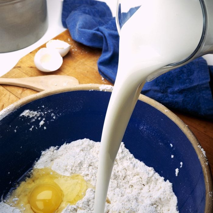 pouring buttermilk into cake mix