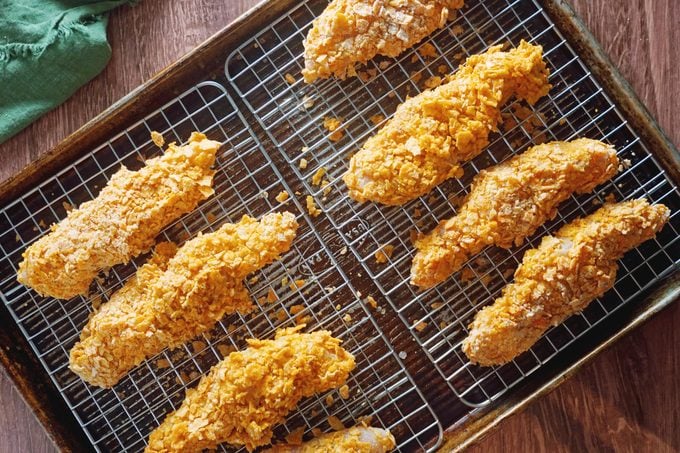 Dorito Chicken Tenders on a baking pan