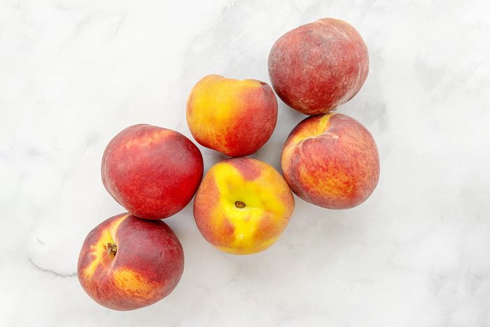 Fresh Ripe Peaches on a countertop in a kitchen