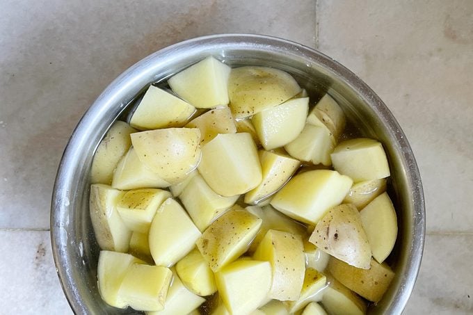 potatoes in water in a bowl