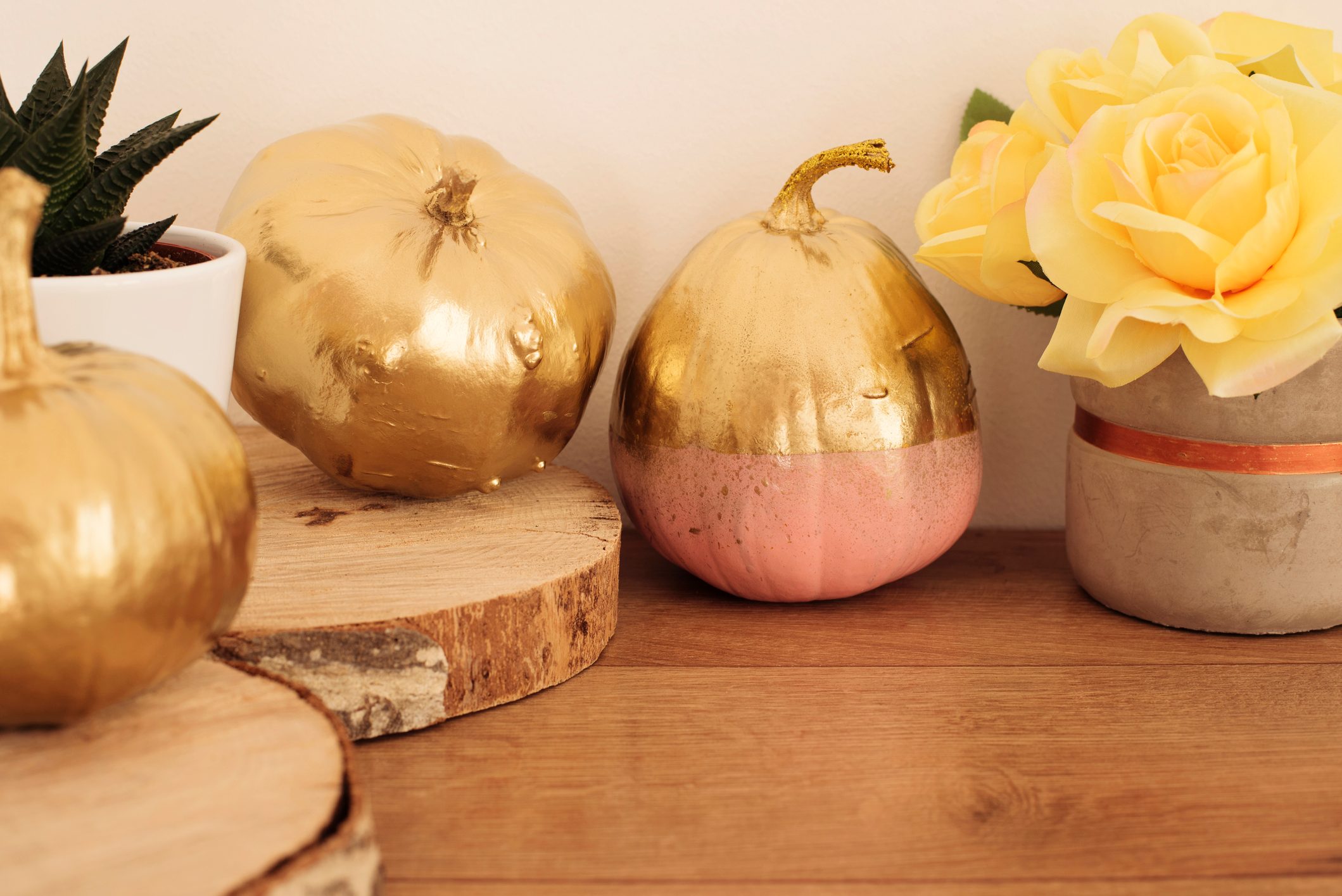Gold and pink colored pumpkins