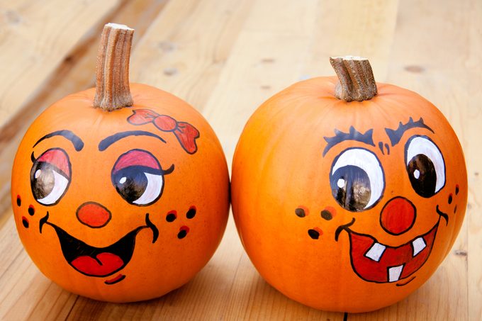 two Painted pumpkins with funny faces