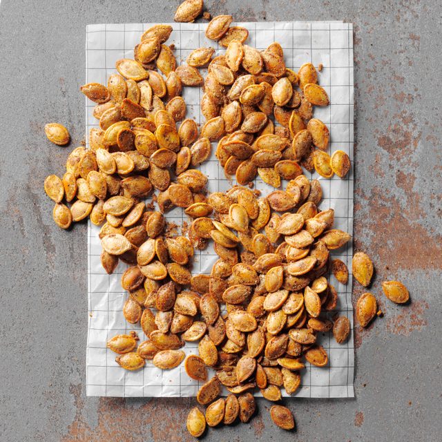 roasted pumpkin seeds on a kitchen towel
