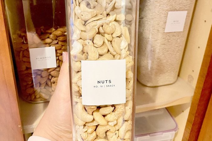 TikTok Pantry label on a tall plastic storage container filled with nuts