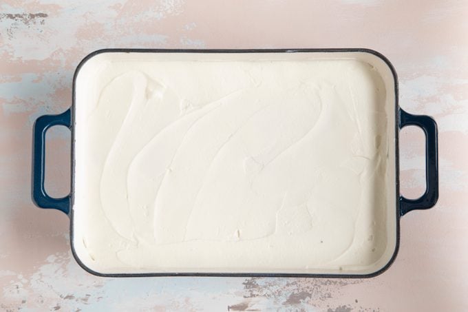 spread whipped cream on oreo ice box cake