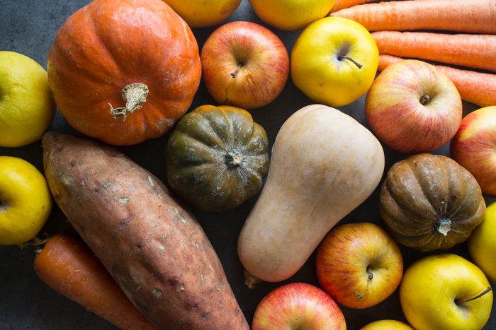 Vibrant colors of fresh autumn fruits and vegetables.