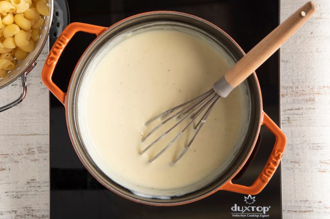 whisk in milk to roux for mac and cheese