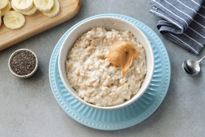 Oatmeal porridge with peanut butter and bananas