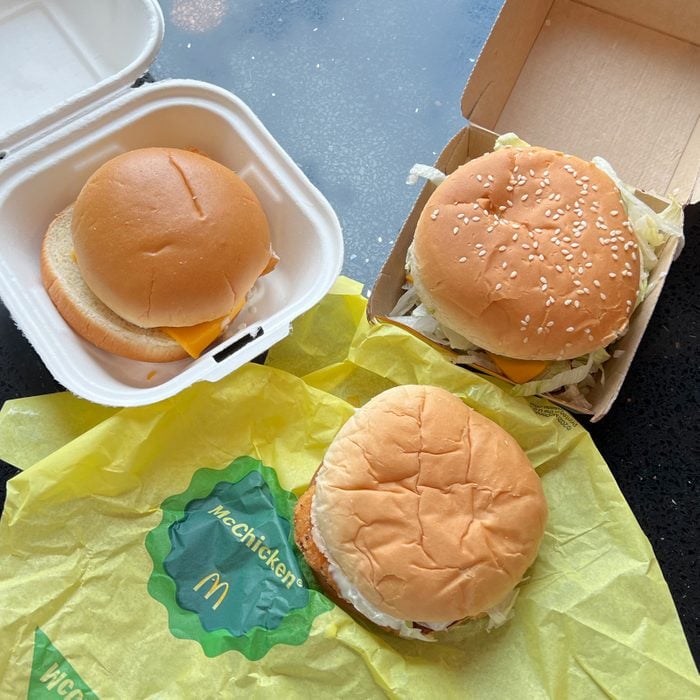 three sandwiches from mcdonaldds on top of their packaging
