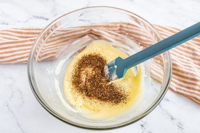 making cookie dough in a clear glass bowl on a kitchen counter