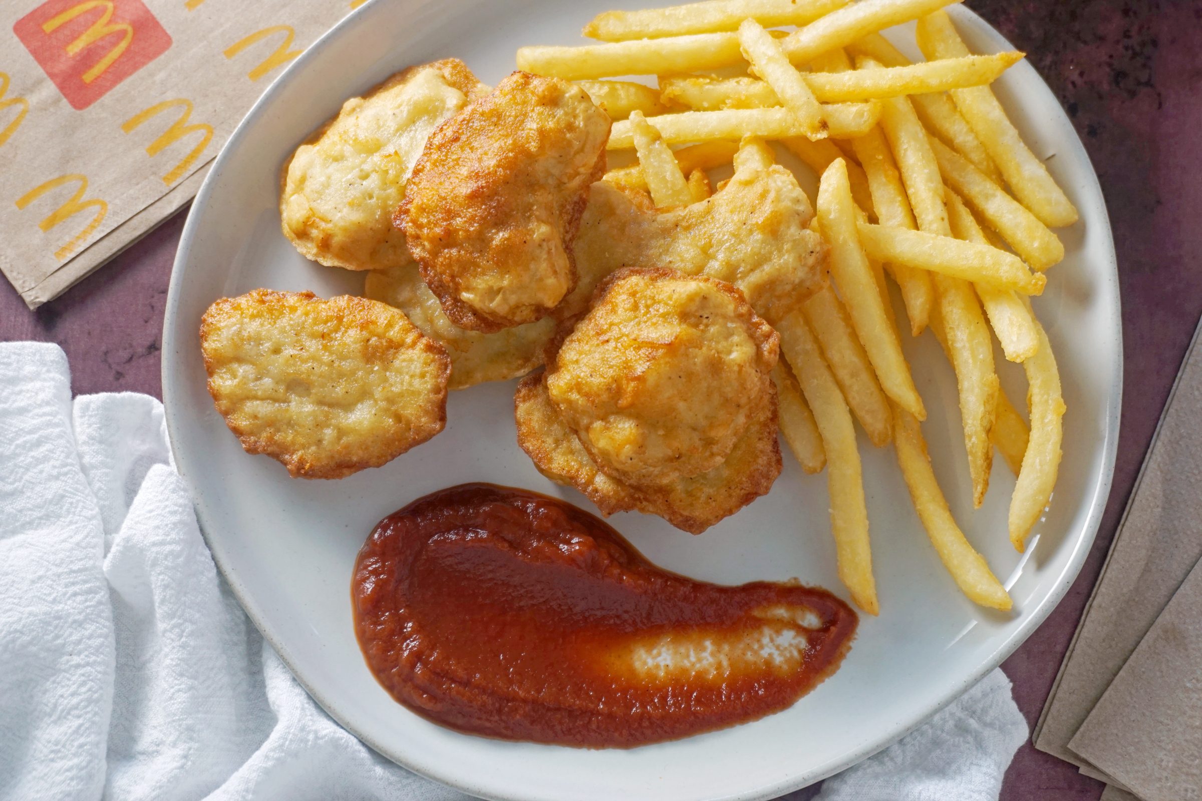 copy cat McDonalds chicken nuggets on a plate with ketchup and fries