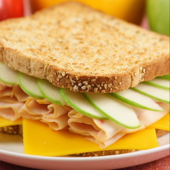 vermonter sandwich with turkey, cheddar and green apples on sliced bread