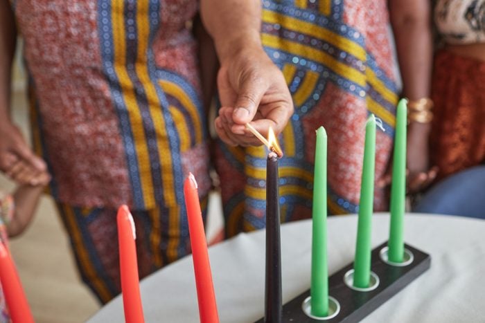 Family burning candles for traditional holiday
