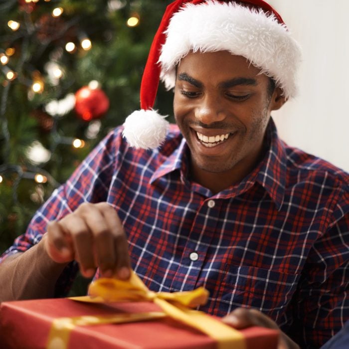 brother opening a christmas gift