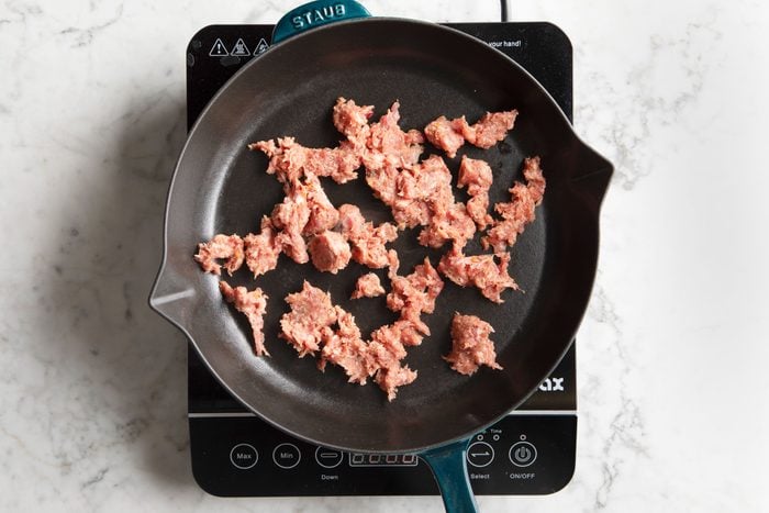 raw meat in a cast iron skillet