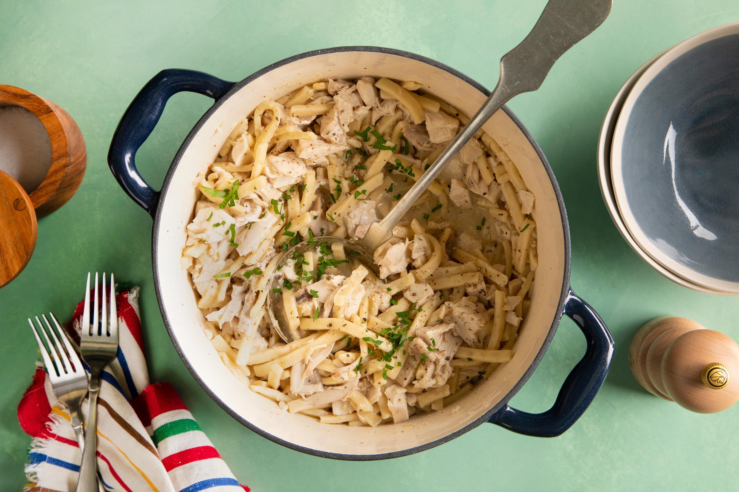 Amish Chicken and Noodles in a pot on a green table
