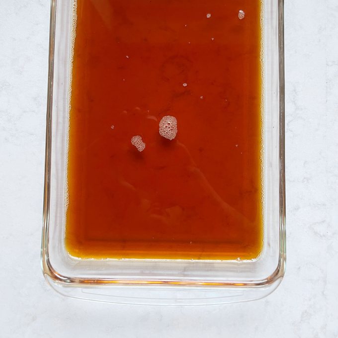 coffee jelly mixture in a clear glass shallow baking dish