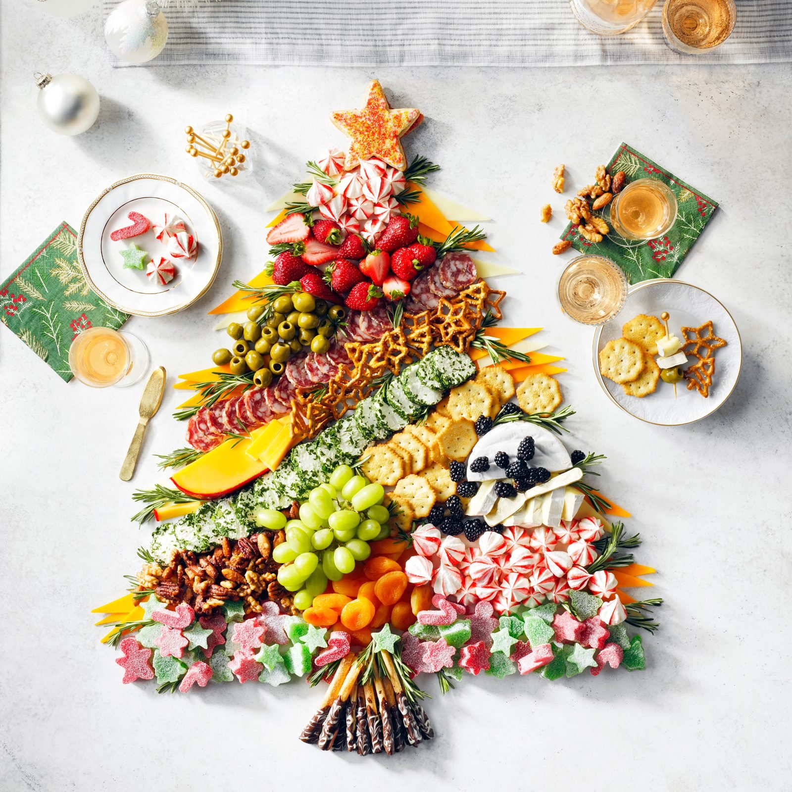 Holiday themed Charcuterie Board in the shape of a christmas tree