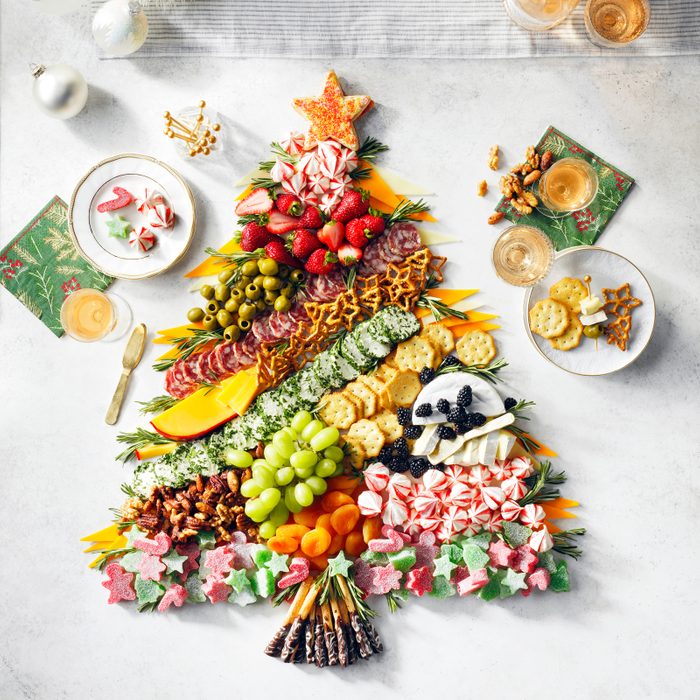 Holiday themed Charcuterie Board in the shape of a christmas tree