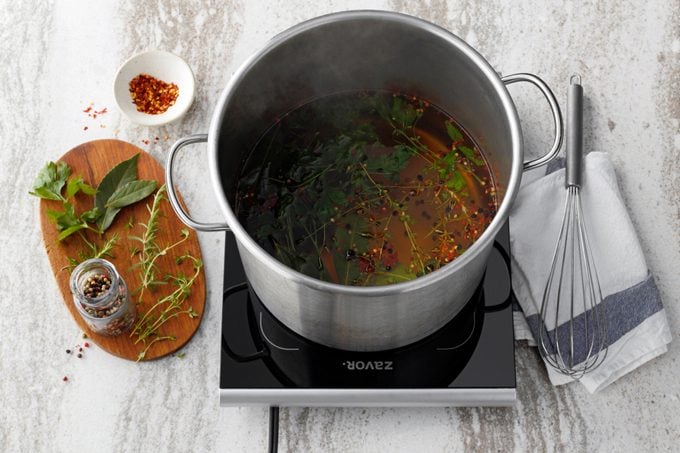 adding spices to the brine stock pot