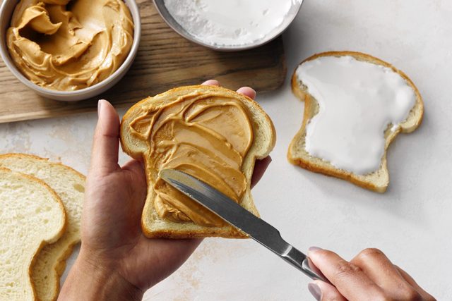 Spread peanut butter and marshmallow fluff evenly over bread slices
