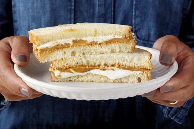 Combine peanut butter bread slice and marshmallow bread slice to make a sandwich