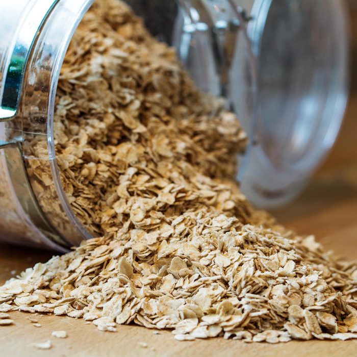 Rolled Oats Falling Out Of Glass Jar