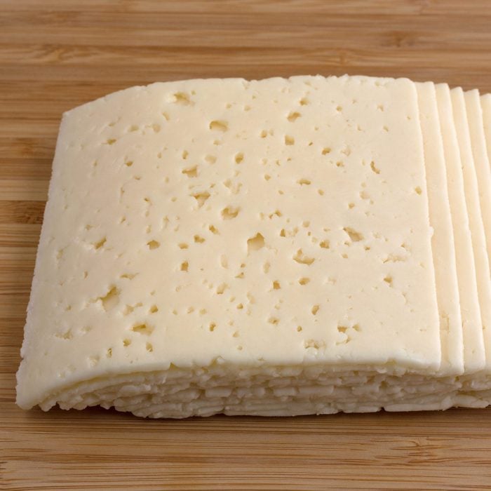 Slices of Havarti cheese on a cutting board