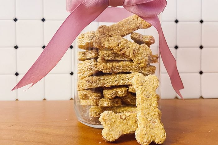 homemade dog treats in a jar on a kitchen counter