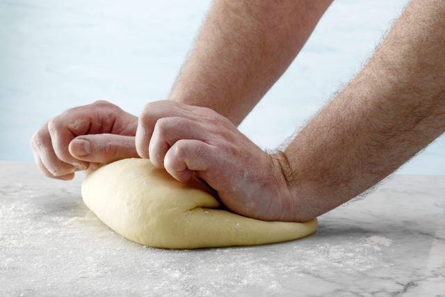Knead dough on a floured surface