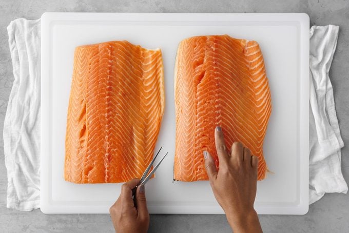 Check for and Remove large pin bones from salmon meat to ensure not to ingest them