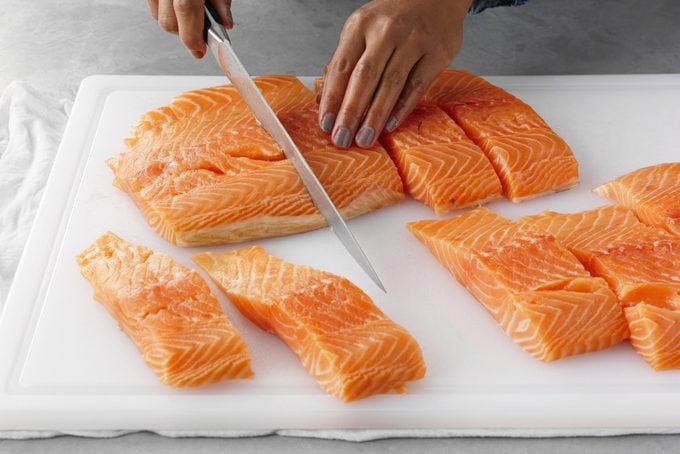 Cut and Portion Out Salmon into single serve portions with a kitchen knife, cover and refrigerate until use