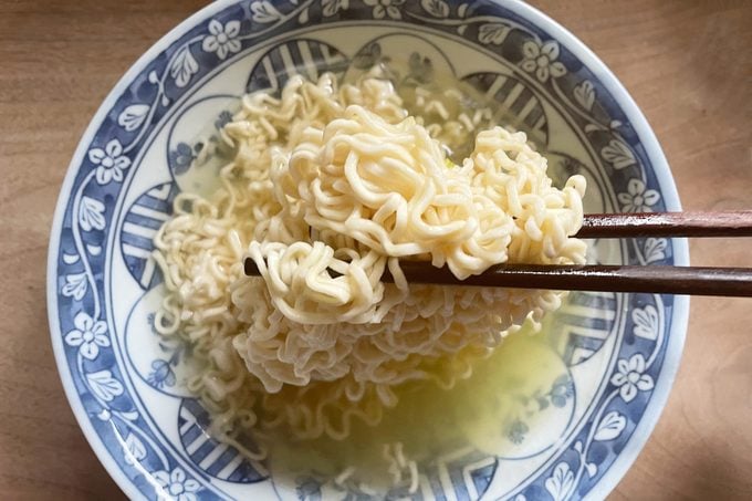 top view of a bowl of ramen with chopsticks